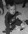 Nolan sitting with toys