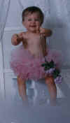 Kyra in tutu with rose