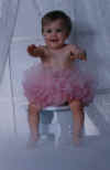 Kyra sitting in her tutu (el frankenstine!)